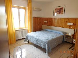 Postel nebo postele na pokoji v ubytování Albergo Ristorante da Settimio