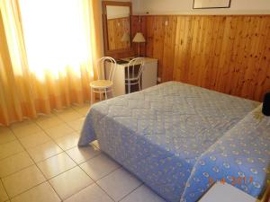 Postel nebo postele na pokoji v ubytování Albergo Ristorante da Settimio