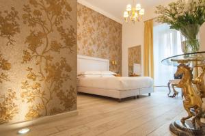 Postel nebo postele na pokoji v ubytování Ripetta Rooms