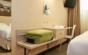 Postel nebo postele na pokoji v ubytování Hotel Parma