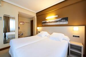 Postel nebo postele na pokoji v ubytování Hotel Parma