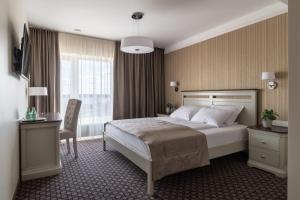 Postel nebo postele na pokoji v ubytování Hotel Sinchronas