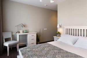 Postel nebo postele na pokoji v ubytování Hotel Sinchronas