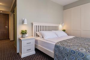 Postel nebo postele na pokoji v ubytování Hotel Sinchronas