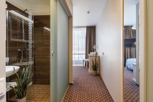 Postel nebo postele na pokoji v ubytování Hotel Sinchronas