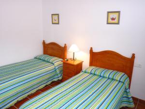 A bed or beds in a room at Holiday Home in Canillas near Beach