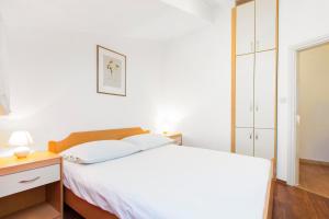 Säng eller sängar i ett rum på Vila Jadranka