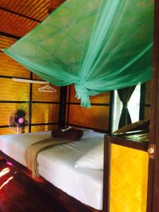 Postel nebo postele na pokoji v ubytování Phayam Garden View