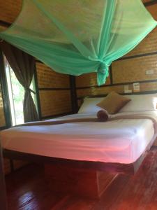 Ένα ή περισσότερα κρεβάτια σε δωμάτιο στο Phayam Garden View