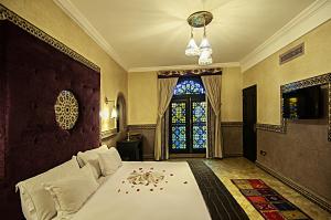 Postel nebo postele na pokoji v ubytování Palais Ommeyad Suites & Spa