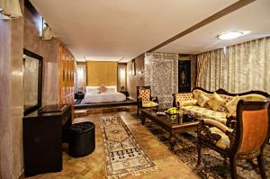 Postel nebo postele na pokoji v ubytování Palais Ommeyad Suites & Spa