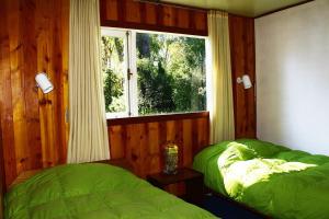 Cama o camas de una habitación en Cabañas & Piscina Rucamalen
