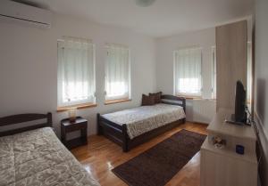 Postel nebo postele na pokoji v ubytování Guesthouse Rota