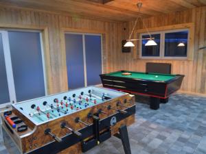 a living room with a pool table and a pool table at Modern Holiday Home in Sourbrodt with Private Pool in Sourbrodt