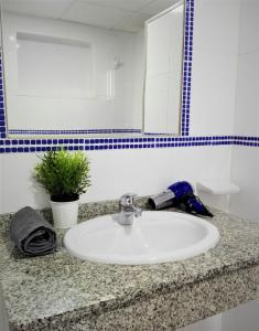 Et badeværelse på Apartamento Renovado,vistas piscina, aire acondicionado,wifi