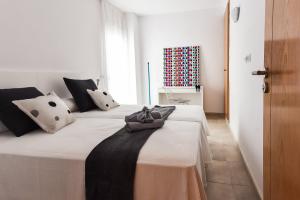 Postel nebo postele na pokoji v ubytování Sal Mar Suites + 37 fotografií