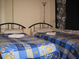 Postel nebo postele na pokoji v ubytování Hotel Sophia