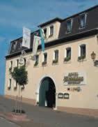 a large building with a sign on the side of it at Hotel Rebmann in Leinsweiler