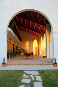 an outdoor patio with a table in a building at Agriturismo Monte Scala in Taglio di Po