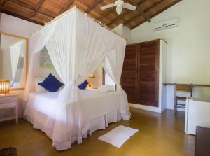 Cama ou camas em um quarto em Pousada Casinhas da Bahia