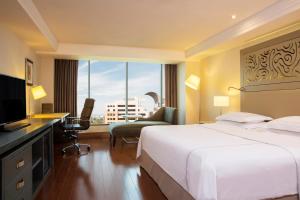 Ένα ή περισσότερα κρεβάτια σε δωμάτιο στο Barcelo Guadalajara