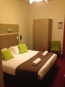 Un pat sau paturi într-o cameră la Hotel Cote Patio