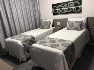Katil atau katil-katil dalam bilik di Verona Tower Hotel