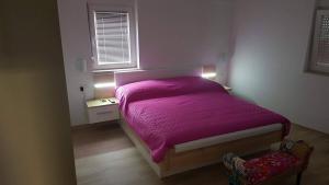 Postel nebo postele na pokoji v ubytování Apartments Roko Kolinda