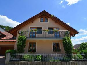 a house with flower boxes on the balconies at Apartment with private terrace in Prunn in Riedenburg