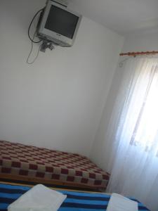 Televízia a/alebo spoločenská miestnosť v ubytovaní Apartments San Giorgio