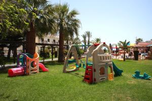a group of playground equipment in a park at Loutsiana Deluxe Apts in Ayia Napa
