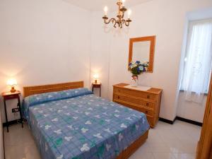 Łóżko lub łóżka w pokoju w obiekcie Flat with terrace 15km from Cinque Terre
