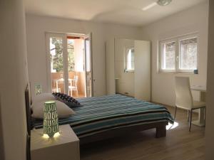 Postel nebo postele na pokoji v ubytování Apartments Karaba