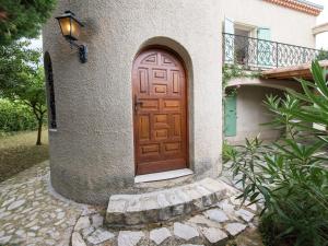 a wooden door on the side of a house at Beautiful Villa in Nyons with Swimming Pool in Nyons