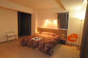 Postel nebo postele na pokoji v ubytování Kyridis Hotel