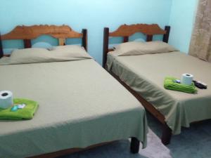 Giường trong phòng chung tại Hotel Chaac Calakmul