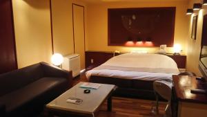 Postel nebo postele na pokoji v ubytování Hotel Sting
