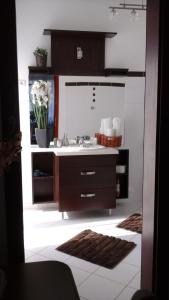 a bathroom with a sink and a mirror at Villa Cecile in Sopron