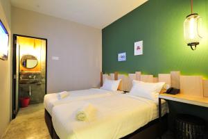 Postel nebo postele na pokoji v ubytování Finess Basic Hotel