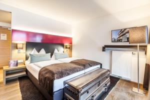 Postel nebo postele na pokoji v ubytování LEDERER Boutique Hotel