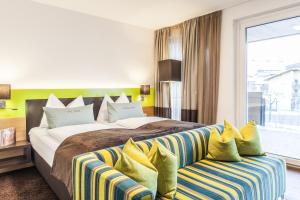 Postel nebo postele na pokoji v ubytování LEDERER Boutique Hotel