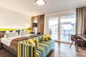 Postel nebo postele na pokoji v ubytování LEDERER Boutique Hotel