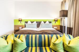 Postel nebo postele na pokoji v ubytování LEDERER Boutique Hotel