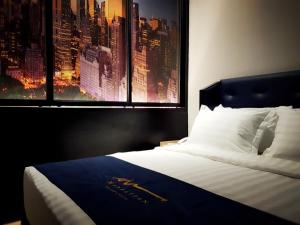 Postel nebo postele na pokoji v ubytování Manhattan Business Hotel TTDI