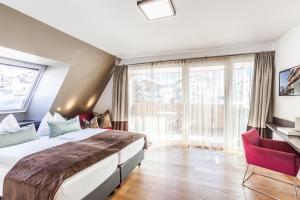 Postel nebo postele na pokoji v ubytování LEDERER Boutique Hotel