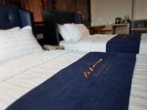Postel nebo postele na pokoji v ubytování Manhattan Business Hotel TTDI