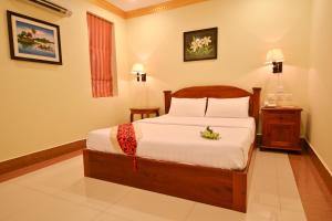 Cama o camas de una habitación en Golden House International Hotel