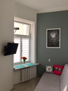 Telewizja i/lub zestaw kina domowego w obiekcie Apartament Żelazna