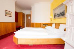 Postel nebo postele na pokoji v ubytování AAAA Hotelwelt KÜBLER