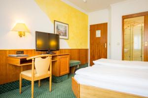 Postel nebo postele na pokoji v ubytování AAAA Hotelwelt KÜBLER